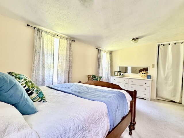 0731 S June Dr, Cromwell, IN 46732 - carpeted bedroom with a textured ceiling