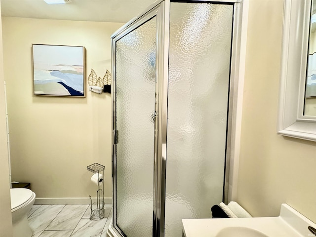 0731 S June Dr, Cromwell, IN 46732 - bathroom with toilet, a stall shower, marble look tile flooring, vanity, and baseboards