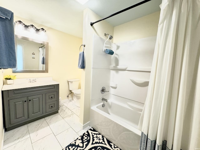 0731 S June Dr, Cromwell, IN 46732 - full bath featuring marble finish flooring, toilet, vanity, shower / bathtub combination with curtain, and baseboards