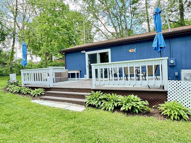 0731 S June Dr, Cromwell, IN 46732 - back of property with a lawn and a deck
