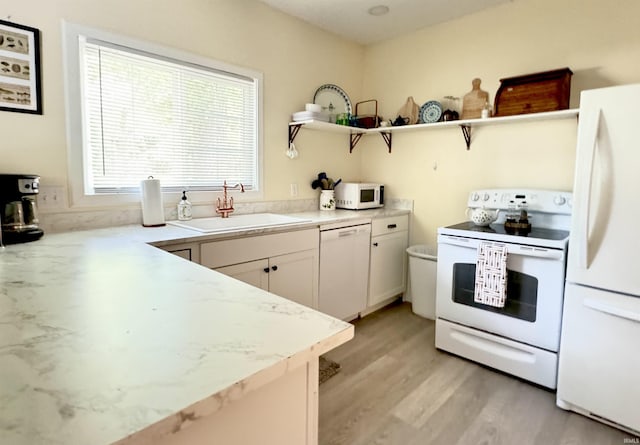 0731 S June Dr, Cromwell, IN 46732 - kitchen featuring white appliances, open shelves, a sink, light wood-style flooring, and white cabinetry