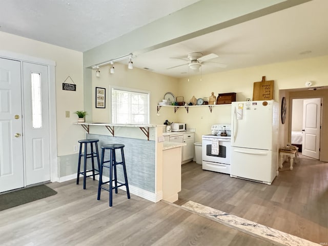 0731 S June Dr, Cromwell, IN 46732 - kitchen featuring white appliances, a breakfast bar area, open shelves, ceiling fan, and light wood-type flooring