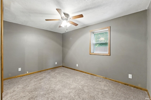 714 Hazel St, Auburn, IN 46706 - spare room with carpet, ceiling fan, baseboards, and a textured ceiling
