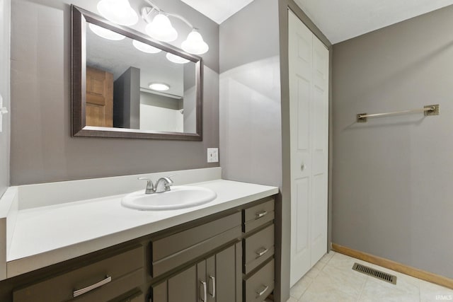 714 Hazel St, Auburn, IN 46706 - bathroom with vanity, tile patterned flooring, and baseboards