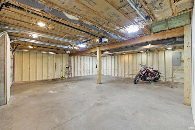 714 Hazel St, Auburn, IN 46706 - garage featuring electric panel and a garage door opener