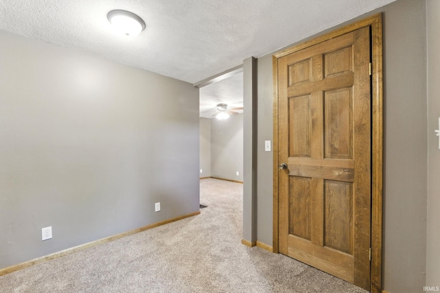 714 Hazel St, Auburn, IN 46706 - carpeted empty room with a textured ceiling, baseboards, and a ceiling fan