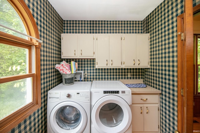 59483 Clover Rd, Mishawaka, IN 46544 - laundry room featuring wallpapered walls, cabinet space, washing machine and dryer, and plenty of natural light