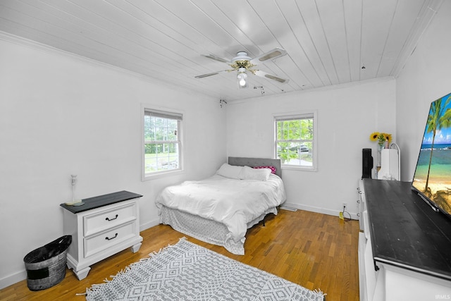 59483 Clover Rd, Mishawaka, IN 46544 - bedroom featuring ornamental molding, wood finished floors, wooden ceiling, a ceiling fan, and baseboards