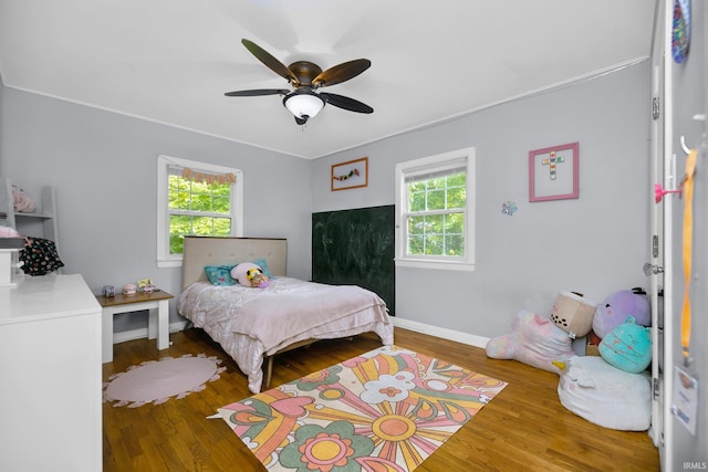 59483 Clover Rd, Mishawaka, IN 46544 - bedroom featuring wood finished floors, ornamental molding, ceiling fan, and baseboards