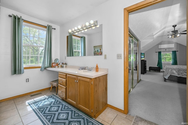 59483 Clover Rd, Mishawaka, IN 46544 - ensuite bathroom with vanity, baseboards, tile patterned floors, ceiling fan, and lofted ceiling
