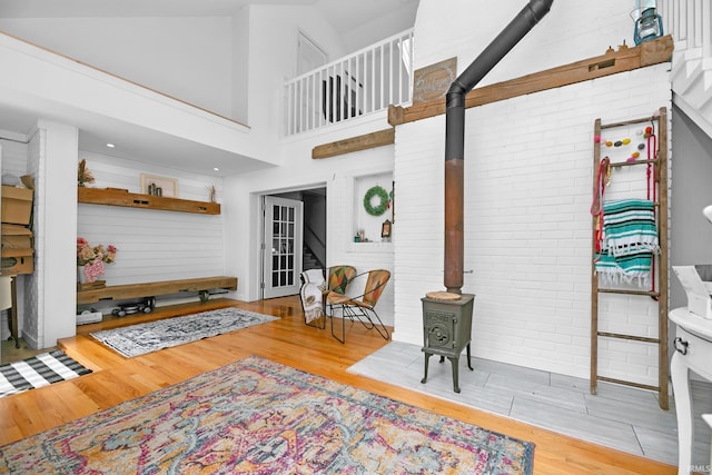 59483 Clover Rd, Mishawaka, IN 46544 - living room with a wood stove, wood finished floors, and high vaulted ceiling