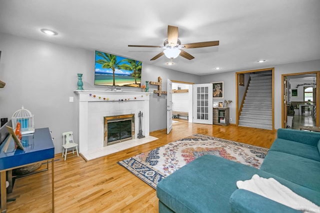 59483 Clover Rd, Mishawaka, IN 46544 - living area featuring a ceiling fan, a fireplace, stairs, wood finished floors, and recessed lighting