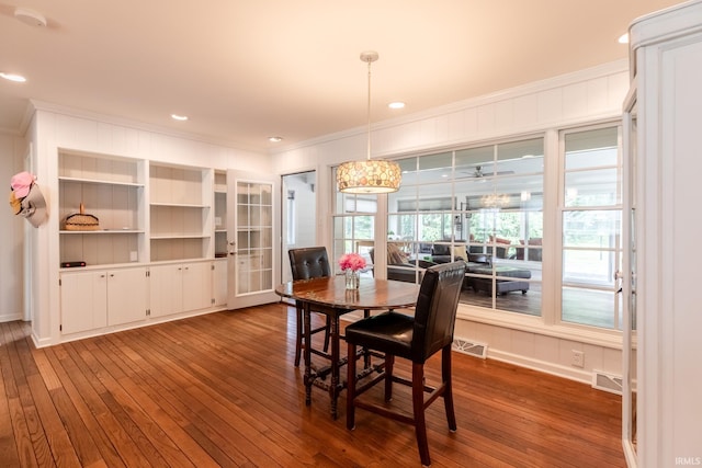 4000 E Stonegate Dr, Bloomington, IN 47401 - dining area featuring ornamental molding, dark wood-style floors, and baseboards