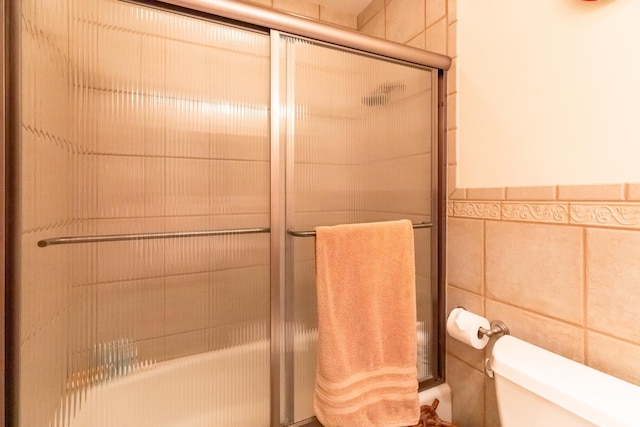 4000 E Stonegate Dr, Bloomington, IN 47401 - full bath with a shower with shower door, toilet, and tile walls