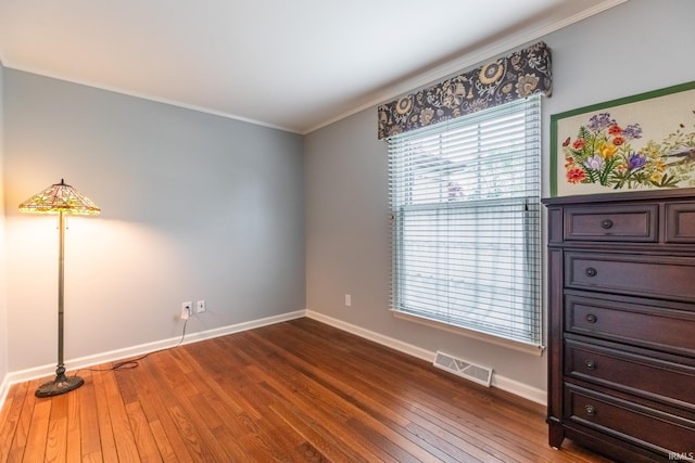 4000 E Stonegate Dr, Bloomington, IN 47401 - unfurnished bedroom with ornamental molding, baseboards, and dark wood-style flooring