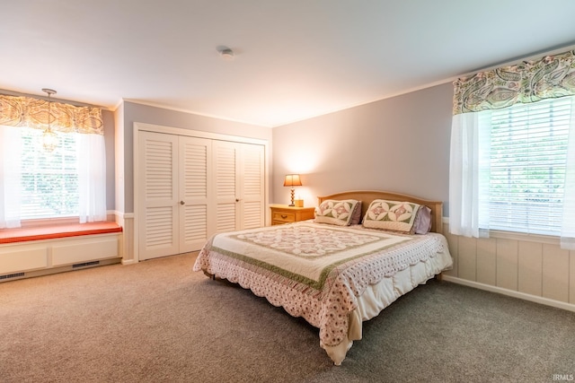 4000 E Stonegate Dr, Bloomington, IN 47401 - carpeted bedroom with a closet and ornamental molding