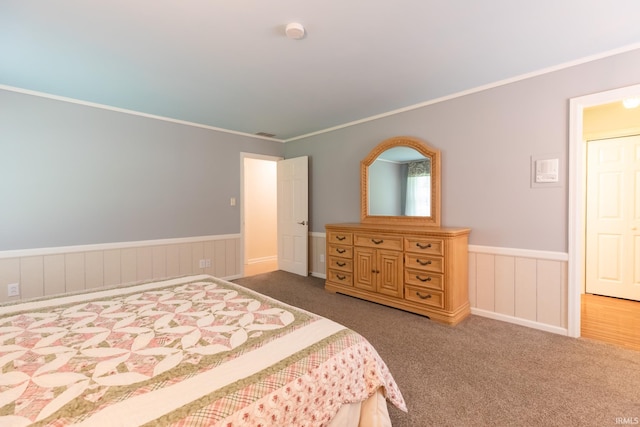 4000 E Stonegate Dr, Bloomington, IN 47401 - bedroom with wainscoting, carpet, and ornamental molding