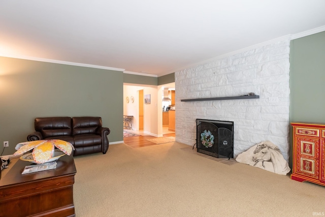 4000 E Stonegate Dr, Bloomington, IN 47401 - living room with crown molding, carpet, a stone fireplace, and baseboards