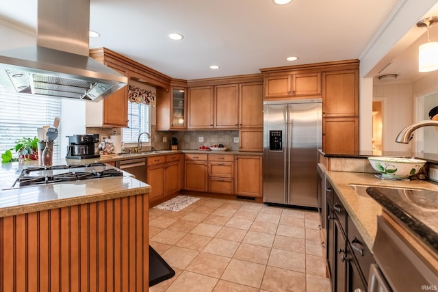 4000 E Stonegate Dr, Bloomington, IN 47401 - kitchen with stainless steel appliances, wall chimney exhaust hood, a sink, decorative backsplash, and brown cabinets