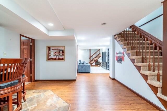 15304 Wild Meadows Pl, Leo, IN 46765 - stairway featuring wood finished floors, baseboards, and recessed lighting