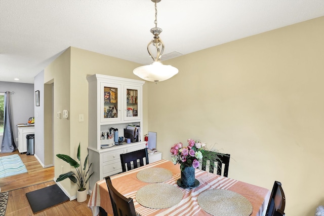 2210 S Laurelwood Cir, Bloomington, IN 47401 - dining space featuring light wood-style flooring and baseboards