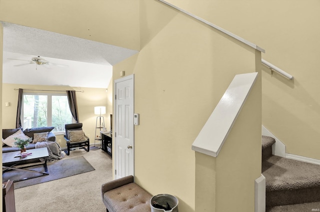2210 S Laurelwood Cir, Bloomington, IN 47401 - stairway with carpet floors, ceiling fan, and vaulted ceiling