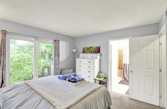 2210 S Laurelwood Cir, Bloomington, IN 47401 - bedroom featuring carpet flooring, ensuite bath, and a textured ceiling