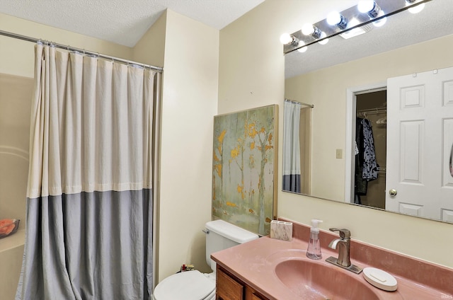 2210 S Laurelwood Cir, Bloomington, IN 47401 - bathroom featuring toilet, vanity, a textured ceiling, and curtained shower