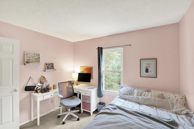 2210 S Laurelwood Cir, Bloomington, IN 47401 - carpeted bedroom with a textured ceiling, a desk, and baseboards