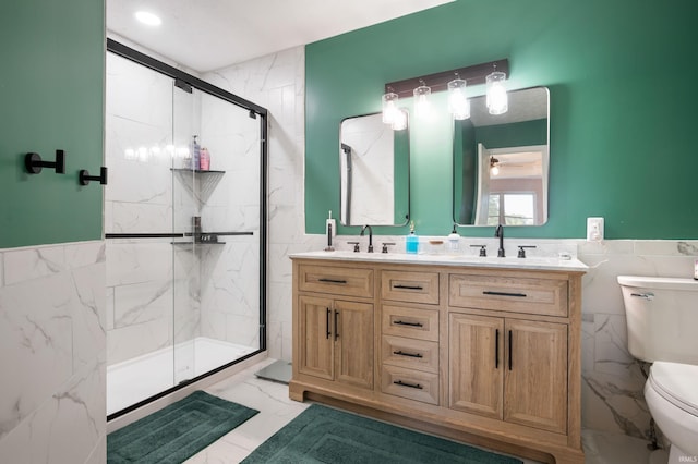 7805 W Kennedy Pkwy, Yorktown, IN 47396 - full bath featuring tile walls, toilet, marble look tile flooring, double vanity, and a marble finish shower