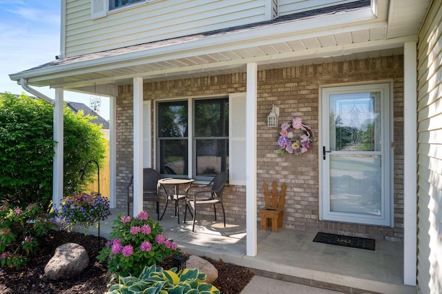 7805 W Kennedy Pkwy, Yorktown, IN 47396 - view of exterior entry featuring a porch and brick siding