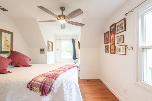 1203 W 6th St, Bloomington, IN 47404 - bedroom featuring wood finished floors, lofted ceiling, baseboards, and a ceiling fan