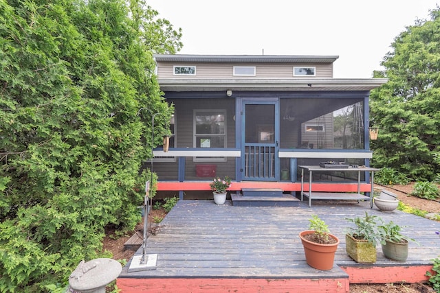 1203 W 6th St, Bloomington, IN 47404 - view of front of property featuring a wooden deck and a sunroom