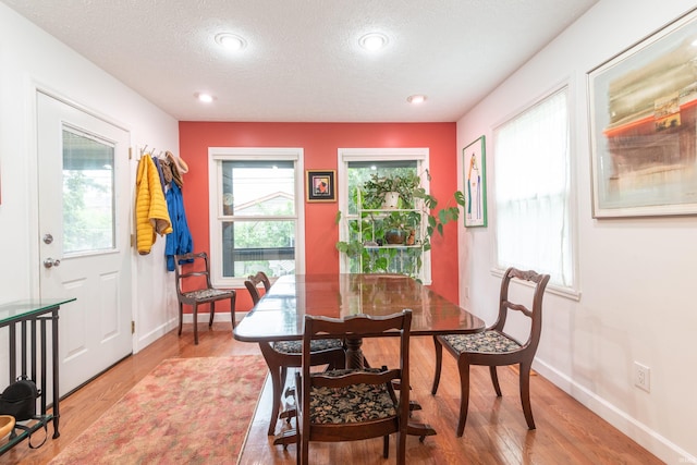 1203 W 6th St, Bloomington, IN 47404 - dining room with light wood-style flooring, a textured ceiling, baseboards, and recessed lighting