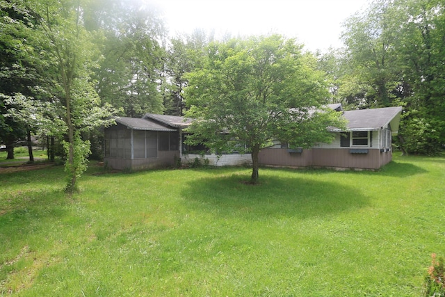 56825 Elmer Ave, South Bend, IN 46619 - view of green lawn with a sunroom