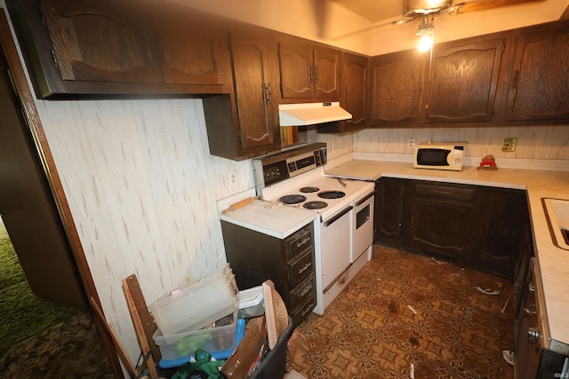 56825 Elmer Ave, South Bend, IN 46619 - kitchen featuring white appliances, under cabinet range hood, and light countertops