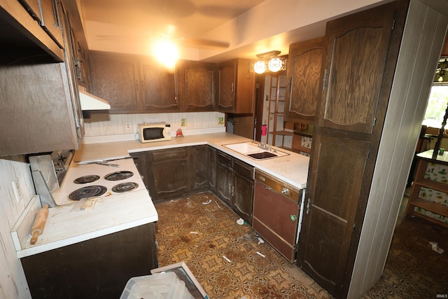 56825 Elmer Ave, South Bend, IN 46619 - kitchen featuring a sink, white microwave, light countertops, and under cabinet range hood