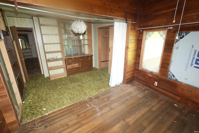 56825 Elmer Ave, South Bend, IN 46619 - empty room featuring wood walls and a chandelier