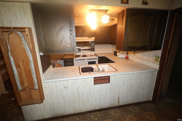56825 Elmer Ave, South Bend, IN 46619 - kitchen featuring white appliances, a sink, under cabinet range hood, and light countertops