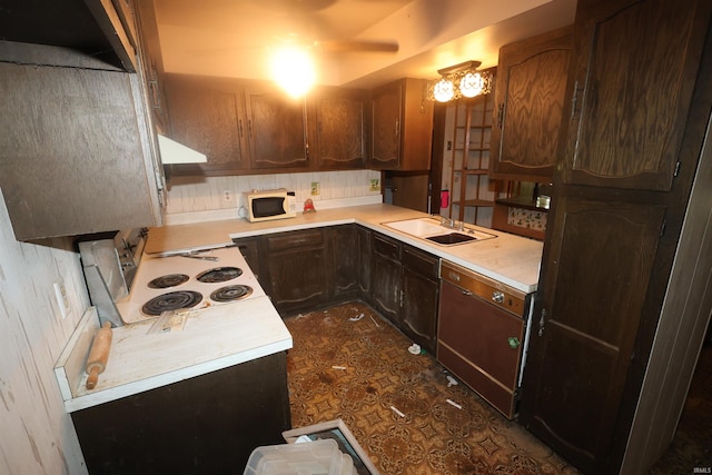 56825 Elmer Ave, South Bend, IN 46619 - kitchen with white microwave, dishwasher, light countertops, a sink, and extractor fan