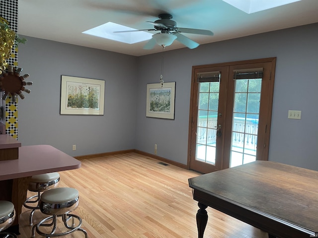 15010OLDSTATE Old State Rd, Evansville, IN 47725 - dining room featuring a skylight, light wood finished floors, ceiling fan, and french doors