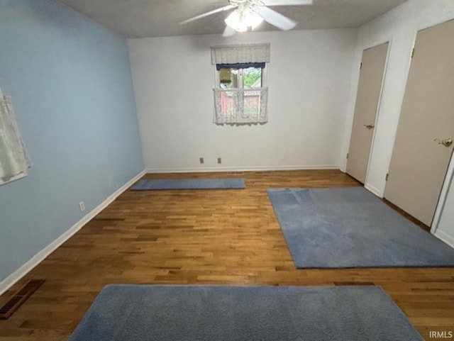 1880 N Michael Dr, Marion, IN 46952 - empty room featuring ceiling fan, wood finished floors, and baseboards