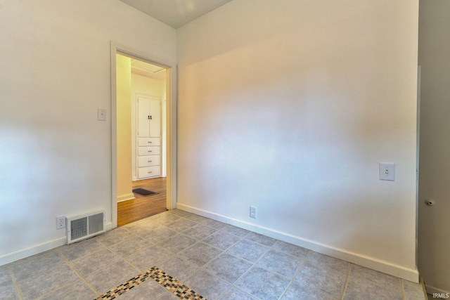 2305 E Virginia St, Evansville, IN 47711 - spare room with baseboards and tile patterned floors