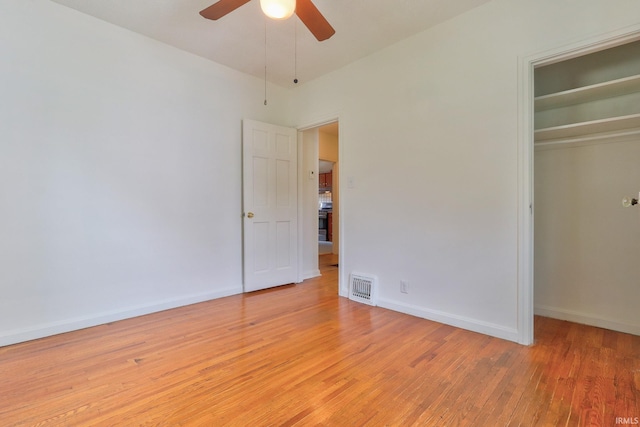 2305 E Virginia St, Evansville, IN 47711 - unfurnished bedroom featuring light wood-style floors, a closet, baseboards, and a ceiling fan