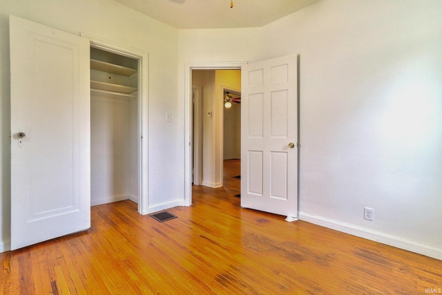 2305 E Virginia St, Evansville, IN 47711 - unfurnished bedroom featuring baseboards, light wood-style floors, and a closet