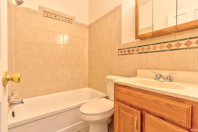 2305 E Virginia St, Evansville, IN 47711 - bathroom featuring vanity, toilet, bathing tub / shower combination, and tile walls