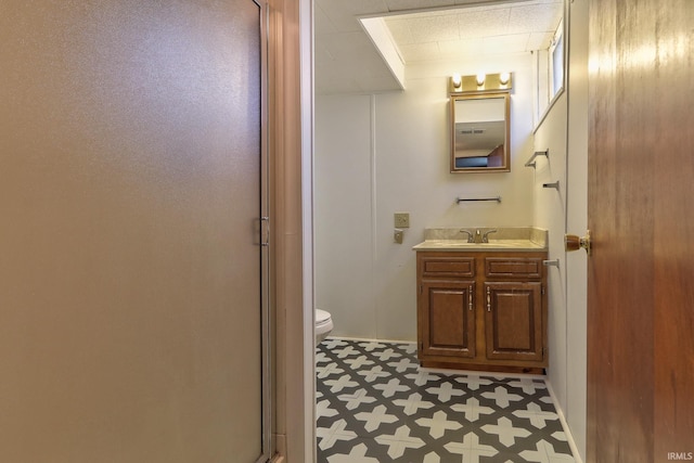 2305 E Virginia St, Evansville, IN 47711 - bathroom featuring tile patterned floors, vanity, toilet, and a shower stall