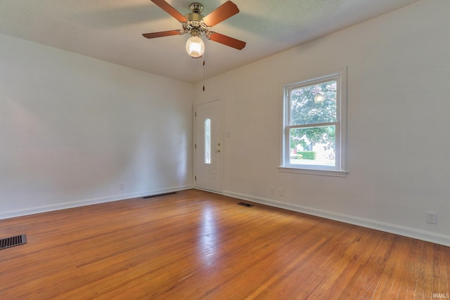 2305 E Virginia St, Evansville, IN 47711 - empty room featuring light wood-style floors, baseboards, and a ceiling fan