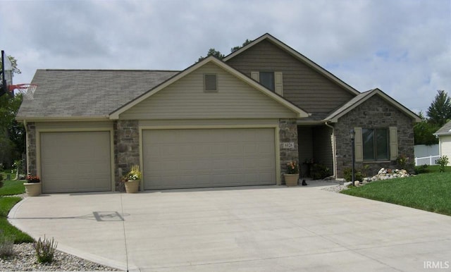 6026 Hemingway Run, Fort Wayne, IN 46814 - craftsman house featuring stone siding, an attached garage, and concrete driveway
