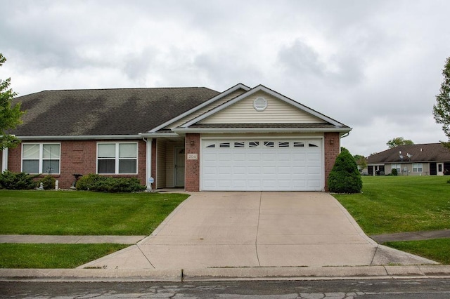 204 Coronet St, Angola, IN 46703 - ranch-style house featuring brick siding, concrete driveway, a front lawn, and an attached garage